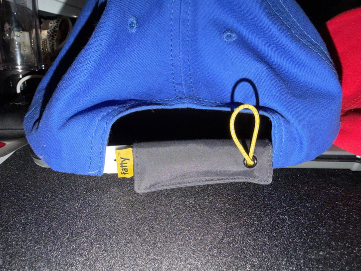 FattyPack on the back of a blue hat