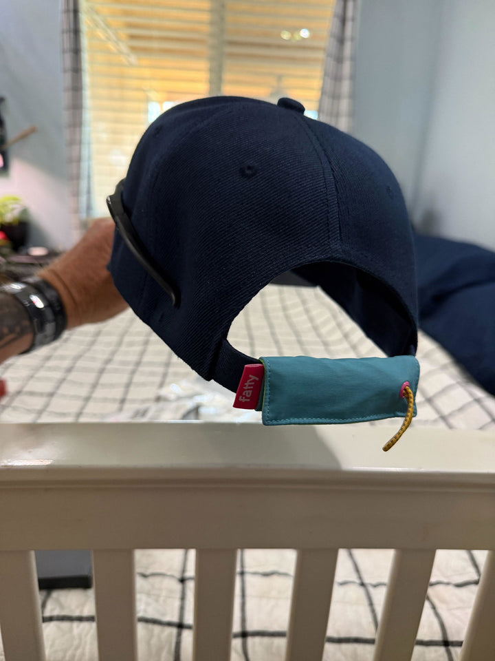 FattyPack on the back of a customer's ball cap