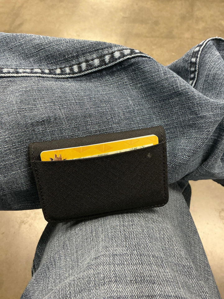 Snap Wallet full of cards on a customer's knee